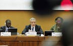 Mohamed Auajjar, center, Chairperson of the Independent Fact-Finding Mission on Libya, Chaloka Beyani, left, and Tracy Robinson, members of the Fact-F