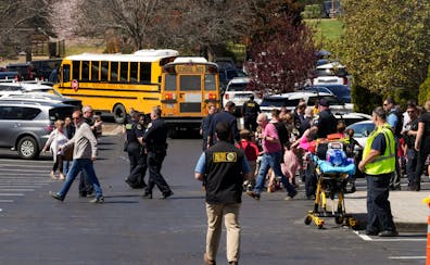 The scene outside a nearby church that had been set up as a reunification area for parents to meet their children after a shooting at a private Christ