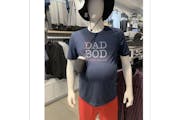 A screenshot of a Reddit post from four years ago shows a mannequin sporting TravisMathew’s “Dad Bod” T-shirt in an undisclosed location.