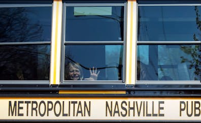 A child weeps while on the bus leaving The Covenant School following a mass shooting at the school in Nashville, Tenn., Monday, March 27, 2023. (Nicol