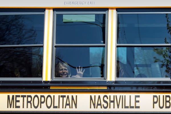A child weeps while on the bus leaving The Covenant School following a mass shooting at the school in Nashville, Tenn., Monday, March 27, 2023. (Nicol