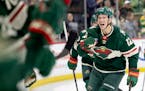 Matt Boldy (12) of the Minnesota Wild celebrates with teammates after scoring a goal in the second period.