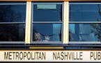 A child weeps while on the bus leaving The Covenant School after a mass shooting Monday at the school in Nashville, Tenn.