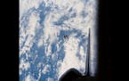 A photo provided by NASA shows a piece of debris that strayed from the Earth-orbiting Space Shuttle Challenger in February 1984.