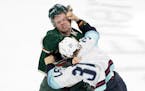 Yanni Gourde of the Kraken and Mason Shaw of the Wild dropped the gloves Monday during the Wild’s 5-1 victory at Xcel Energy Center.