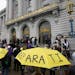 FILE - A crowd listens to speakers at a reparations rally outside of City Hall in San Francisco on March 14, 2023. Economists for a California reparat