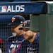 Minnesota Twins manager Rocco Baldelli, right, watches from the dugout during the eighth inning in Game 3 of a baseball American League Division Serie