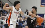 Pepperdine guard Mike Mitchell  (1) defends against Gonzaga guard Andrew Nembhard (3) during the second half of a game last month.