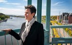 Great River Passage Conservancy nonprofit director Mary deLaittre overlooks the Mississippi River in St. Paul in 2019.