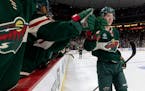 Matt Boldy (12) of the Minnesota Wild celebrates with teammates after scoring a goal in the second period Monday, March 27, 2023, at Xcel Energy Cente