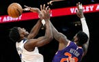Wolves guard Anthony Edwards had his shot blocked by Suns center Deandre Ayton during the first half Wednesday. Despite Edwards’ game-high 31 points