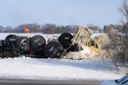 The scene after a BNSF train carrying ethanol and corn syrup derailed and caught fire in the west-central Minnesota town of Raymond.