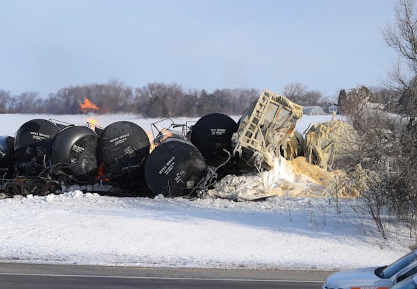 The scene after a BNSF train carrying ethanol and corn syrup derailed and caught fire in the west-central Minnesota town of Raymond.