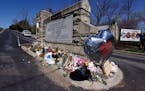 A balloon with names of the victims is seen at a memorial at the entrance to The Covenant School on Wednesday, March 29, 2023, in Nashville, Tenn.