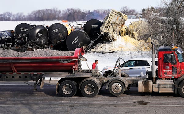 The scene Thursday morning after a train carrying ethanol and corn syrup derailed and caught fire along a BNSF line in the west-central Minnesota town