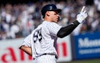 Aaron Judge reacted after hitting a solo home run during the first inning of the Yankees home opener against the Giants.