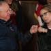 Minnesota Gov. Tim Walz fist-bumped with former U.S. Rep. Gabrielle Giffords during a news conference Thursday at the State Capitol in St. Paul.