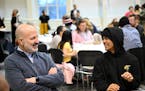 Superintendent Dr. Joe Goddard, left, laughs with Washington student Ujwal Tamang, 15, during an ice breaking exercise Thursday, March 30, 2023 at the