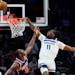 Timberwolves center Naz Reid (11) missed a dunk as Phoenix center Bismack Biyombo (18) defended Wednesday. Reid fell to the court and fractured his wr