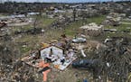 FILE - Debris is strewn about tornado damaged homes, Sunday, March 26, 2023, in Rolling Fork, Miss. Meteorologists are urging people in parts of the M