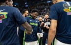 Minnesota Timberwolves guard Anthony Edwards (1) is surrounded by teammates after being introduced before the game. The Minnesota Timberwolves hosted 