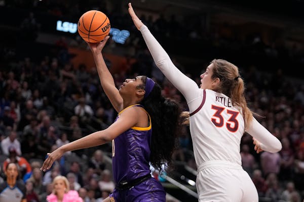 LSU’s Angel Reese shoots past Virginia Tech’s Elizabeth Kitley during the second half of Friday’s Women’s Final Four semifinals 
