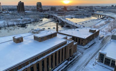 A snowy night has given way to sunnier skies Saturday morning, as seen in downtown Minneapolis.