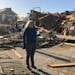 Heidi Jenkins, owner of Boulevard Salon, speaks with a reporter in front of her destroyed business in Wynne, Ark., on Saturday, April 1, 2023. 