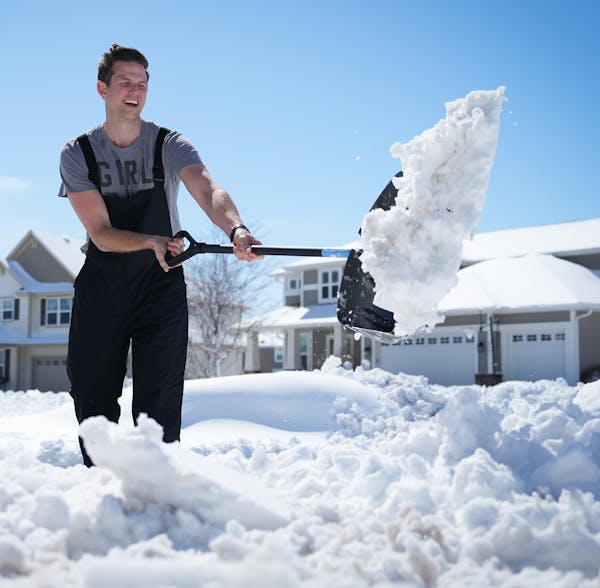 David King shoveled the driveway of his home in Maple Grove on Saturday. “I’m going to get more sun on my arms in two hours of shoveling than I go