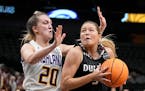 Minnesota Duluth’s Taya Hakamaki tried to get past Ashland’s Maddie Maloney during the first half of the women’s Division II championship Saturd
