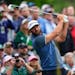 Dustin Johnson plays a practice round at Augusta National Golf Club on Monday. He is one of six Masters champions competing in this week’s tournamen