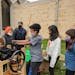 Marshall School students pressed cider at a 2021 event announcing its new nature-based primary school.