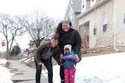 Urban Homeworks’ AsaleSol Young and BLUU’s Lena Gardner and her daughter Winnie on the block of N. Logan Avenue where they will begin construction