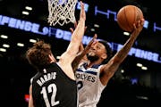 Timberwolves guard Nickeil Alexander-Walker drove to the basket against Nets forward Joe Harris during the first half Tuesday