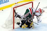 The Penguins’ Ryan Poehling, a former St. Cloud State center from Lakeville, collided with Devils goalie Vitek Vanecek during a Tuesday loss.