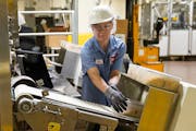 Laura Schuster, a packing specialist, ran a cereal control through a metal detector on the phase 10 cereal line at the Post factory in Northfield, Min