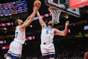 Rudy Gobert (27) and Kyle Anderson (5) reached for a rebound during a game at Atlanta last month.