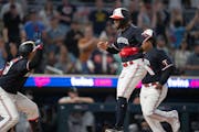 Minnesota Twins right fielder Willi Castro (50) celebrates after scoring in the 10th inning on a bunt by Minnesota Twins center fielder Michael A. Tay