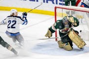 Mason Appleton (22) of the Winnipeg Jets get the puck past Minnesota Wild goalie Marc Andre Fleury (29) for a goal in the third period Tuesday, April 