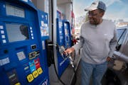 Hopeton Bedward watched the fuel pump on Tuesday as he filled up his vehicle with gasoline at Bobby & Steve’s Auto World in South Minneapolis.