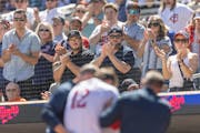 Fans applauded as Twins third baseman Kyle Farmer was helped to the dugout after getting hit by a pitch by Lucas Giolito of the White Sox in the fourt