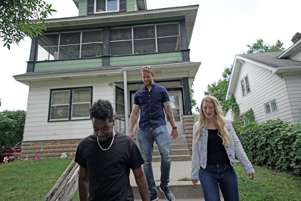 Ben Peters shows Brianna and Thomas Williams a triplex in St. Paul’s North End on Thursday, Aug. 15, 2019.