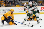 Wild center Frederick Gaudreau, being defended by the Predators’ Ryan McDonagh (27) during the first period Thursday, received a five-year, $10.5 mi