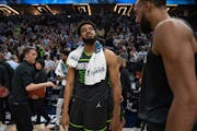The Minnesota twin towns — Karl-Anthony Towns, center, and Rudy Gobert — celebrated after beating Oklahoma City on Friday night.