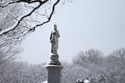 A monument statue as well as trees in Lakewood Cemetery were coated in nearly three inches of fresh snow in early March. The National Weather Service 