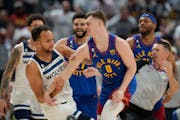 Wolves forward Kyle Anderson, left, got in a scuffle with the Nuggets’ Christian Braun in the second half Sunday night in Denver. “I was obviously