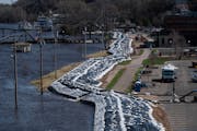 A dike is in place along the St. Croix River on Monday, April 17, 2023, in Stillwater. Many area rivers are going to crest this week, as Minnesota bra