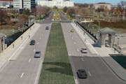 A rendering shows plans for an enhanced bike lane on John Ireland Boulevard.