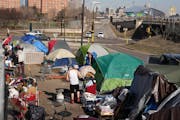 Residents emerged from their tents at the East Phillips homeless encampment in Minneapolis earlier this month.