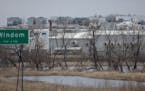 The HyLife Foods pork processing plant looms in the back ground on the outskirts of Windom, Minn., on Wednesday, April 19, 2023. HyLife Foods in Windo